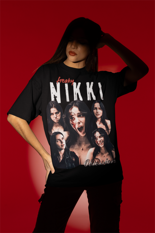 A model wearing a black graphic t-shirt with a large collage print of Nikk's Freaky facial expressions and the rap vintage tee 'freaky NIKKI' and 'Obsession', posed against a solid red background.
